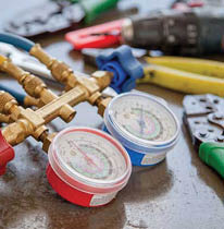 63125165 - technician is checking air conditioner