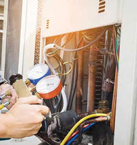 63125165 - technician is checking air conditioner